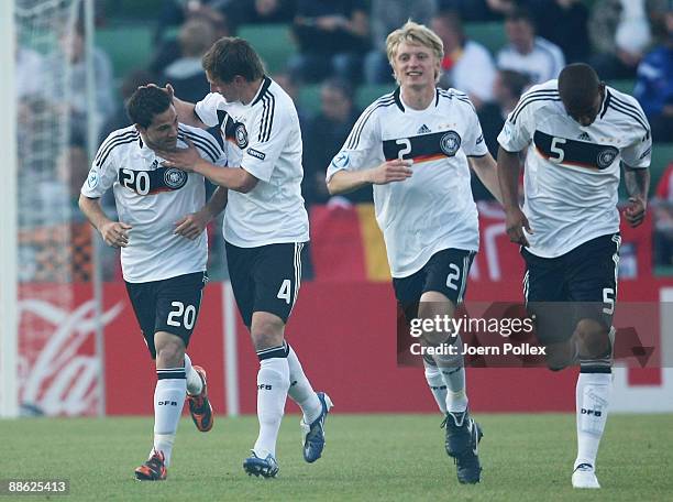 Gonzalo Castro of Germany celebrates with his teams mates Jerome Boateng , Benedikt Hoewedes and Andreas Beck after scoring his teams first goal...