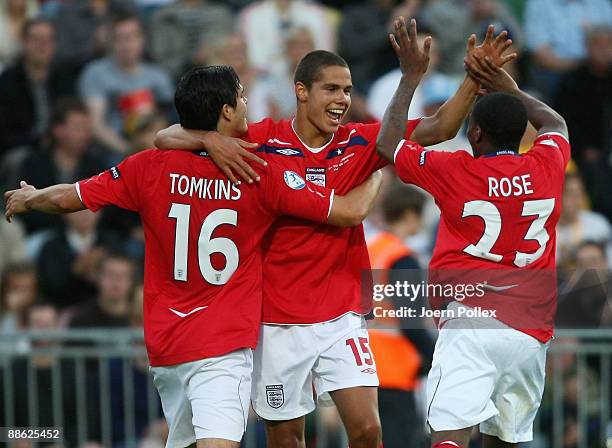 Jack Rodwell of England celebrates with his team mates James Tomkins and Danny Rose after scoring his team's first goal during the UEFA U21...