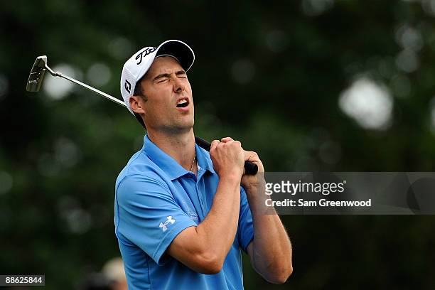 Ross Fisher of England reacts to his missed putt on the 12th hole during the continuation of the final round of the 109th U.S. Open on the Black...
