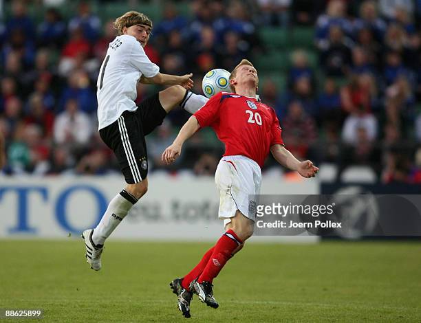 Marcel Schmelzer of Germany and Andrew Driver of England battle for the ball during the UEFA U21 Championship Group B match between Germany and...