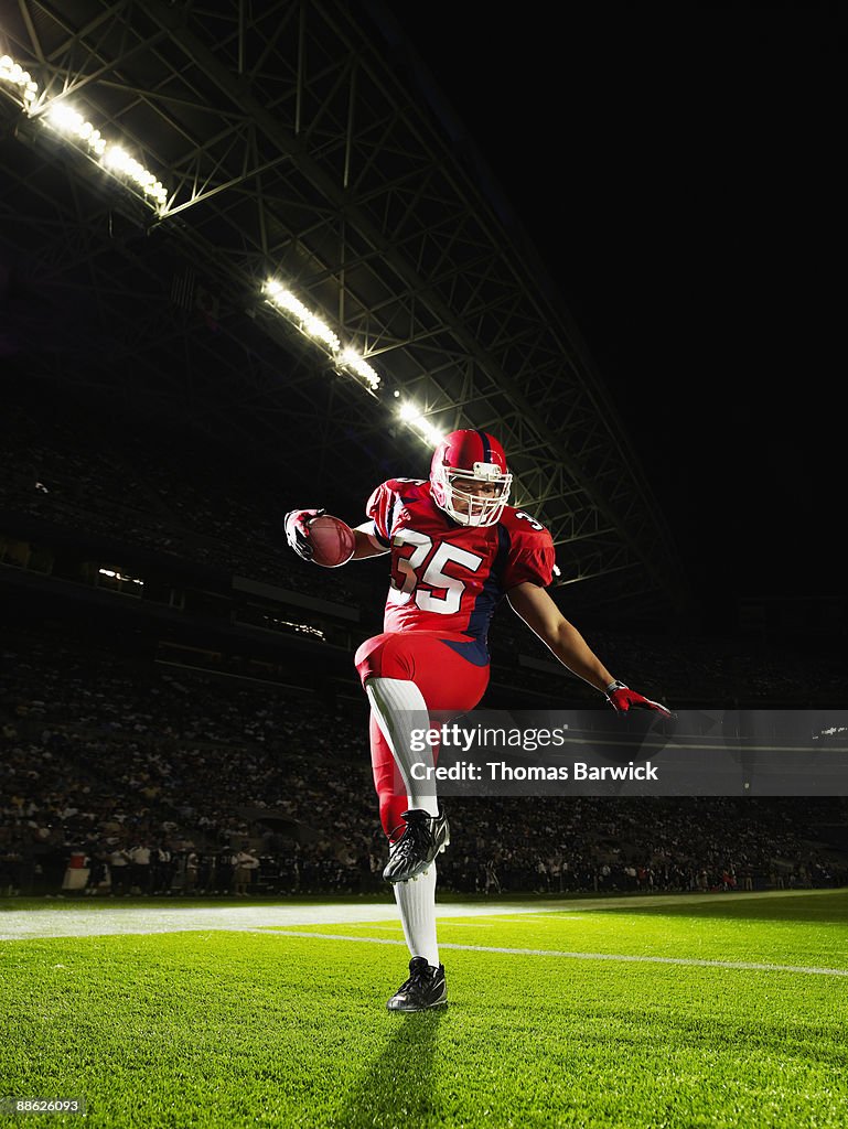 Football player celebrating in end zone