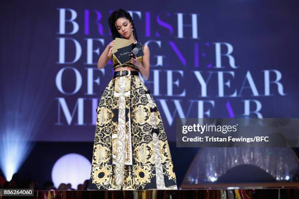 Twigs presents the British Designer of the Year Menswear award on stage during The Fashion Awards 2017 in partnership with Swarovski at Royal Albert...