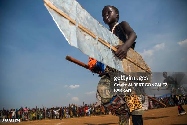 Displaced children perform cultural songs to welcome the visit of US actor Forest Whitaker at the UN Protection of Civilians site in Juba, South...