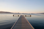 Scenic view of a dock with sunset approaching.