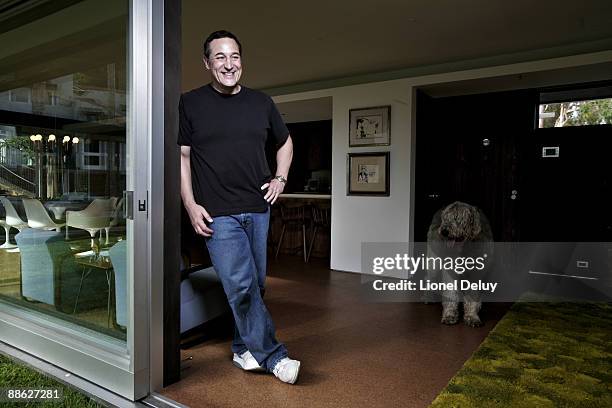 American television producer and writer, one of the original developers of "The Simpsons", is photographed at home for Perfect 10 Magazine.