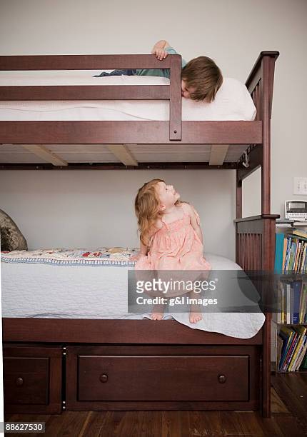 children playing on bunkbed - bunk beds for 3 stock-fotos und bilder