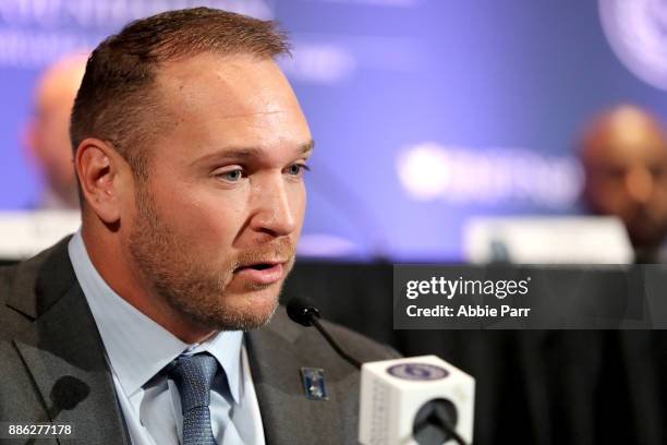 Brian Urlacher speaks among the 2017 College Football Hall of Fame Class during the press conference for the 60th NFF Anual Awards Ceremony at New...