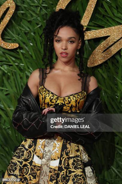 English singer-songwriter FKA twigs poses on the red carpet upon arrival to attend the British Fashion Awards 2017 in London on December 4, 2017. -...