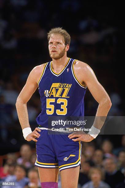 Mark Eaton of the Utah Jazz stands on the court during an NBA game against the Denver Nuggets at McNichols Sports Arena in Denver, Colorado in 1989.