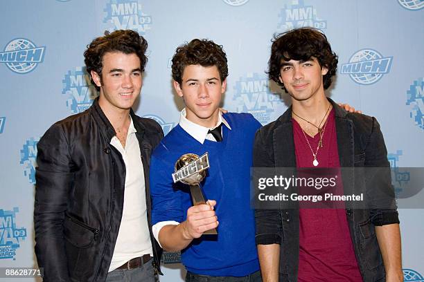 Kevin Jonas, Nick Jonas and Joe Jonas of the Jonas Brothers attend the press room at the 20th Annual MuchMusic Video Awards at the MuchMusic HQ on...