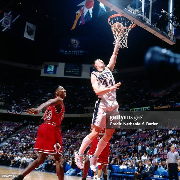 Keith Van Horn of the New Jersey Nets shoots a layup against Scottie Pippen of the Chicago Bulls in Game Three of Eastern Conference Quarterfinals...