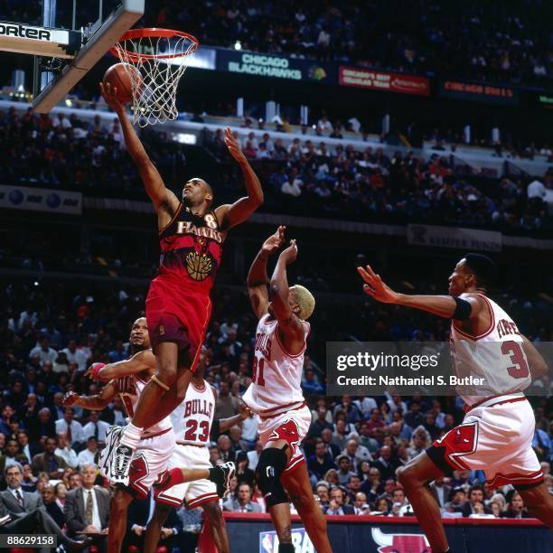 Steve Smith of the Atlanta Hawks shoots a layup against the Chicago Bulls in Game Two of the Eastern Conference Semifinals during the 1997 NBA...