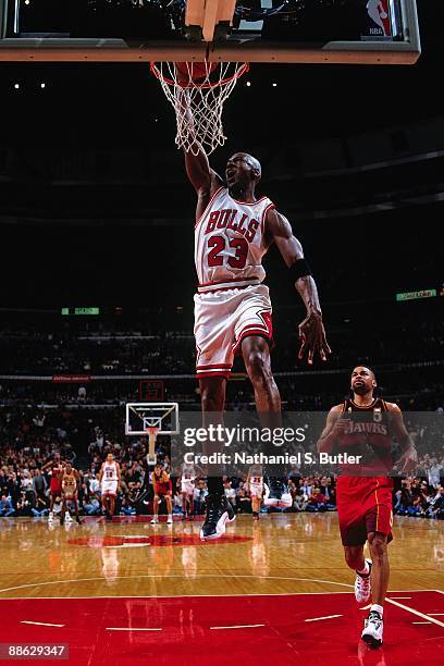 Michael Jordan of the Chicago Bulls dunks against the Atlanta Hawks in Game Five of the Eastern Conference Semifinals during the 1997 NBA Playoffs at...