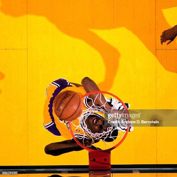 Eddie Jones of the Los Angeles Lakers dunks against the Seattle Supersonics in Game Four of the Western Conference Quarterfinals during the 1995 NBA...