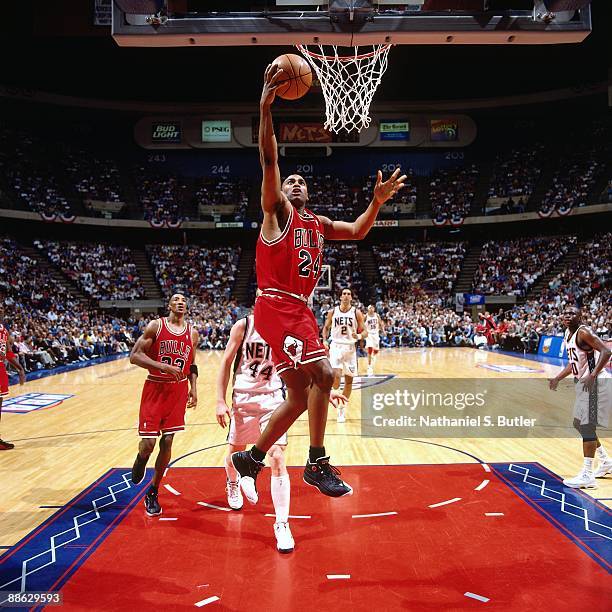 Scott Burrell of the Chicago Bulls shoots a layup against the New Jersey Nets in Game Three of Eastern Conference Quarterfinals during the 1998 NBA...