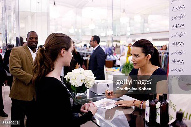 Actress Kristin Davis signs autographs to at Lord And Taylor on June 10, 2009 in New York City.
