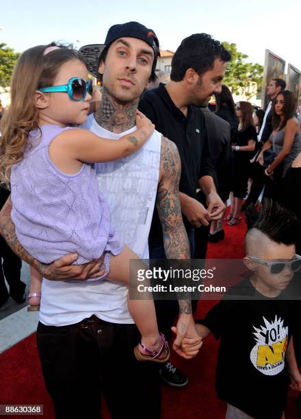 Musician Travis Barker and children arrive on the red carpet of the 2009 Los Angeles Film Festival's premiere of "Transformers: Revenge of the...