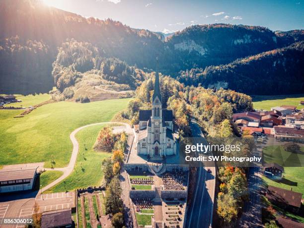 drone photo of lungern church in lungern city, switzerland - lungern switzerland stock-fotos und bilder