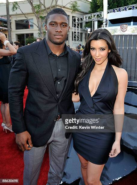 Player Reggie Bush and TV personality Kim Kardashian arrive at the premiere of Dreamworks' "Transformers: Revenge Of The Fallen" held at Mann Village...