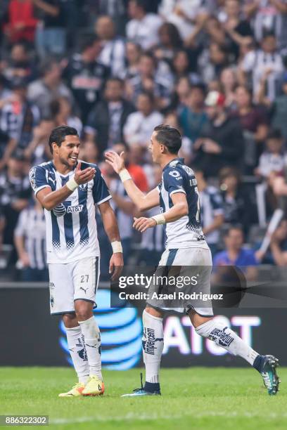 Rogelio Funes Mori of Monterrey celebrates with teammate Jorge Benitez after scoring his team's fourth goal during the semifinal second leg match...