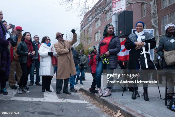 Friends, family and community activists attend the ceremonial street naming of Richie Perez Way on December 3, 2017 on 172nd street and Ward Avenue...