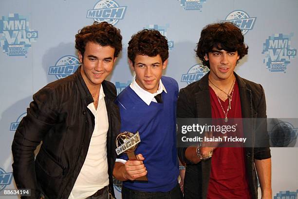 Musicians Kevin Jonas, Nick Jonas and Joe Jonas of Jonas Brothers attend the MuchMusic Video Awards on June 21, 2009 in Toronto, Canada.