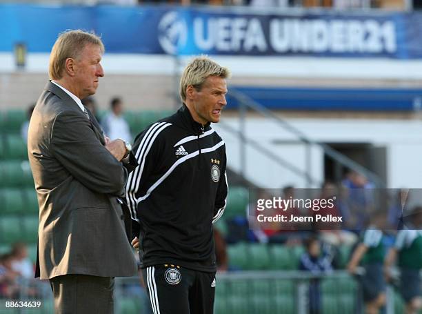 Head coach Horst Hrubesch of Germany and his assistent Thomas Noerenberg are seen during the UEFA U21 Championship Group B match between Germany and...