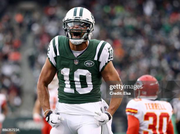 Jermaine Kearse of the New York Jets celebrates his first down as Steven Terrell of the Kansas City Chiefs reacts in the fourth quarter on December...