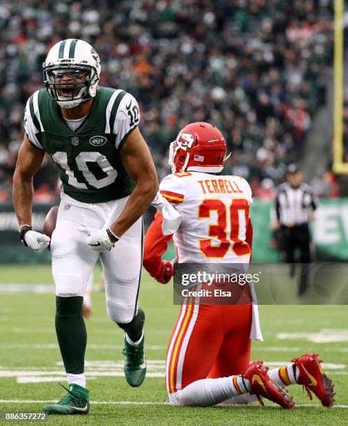 Jermaine Kearse of the New York Jets celebrates his first down as Steven Terrell of the Kansas City Chiefs reacts in the fourth quarter on December...