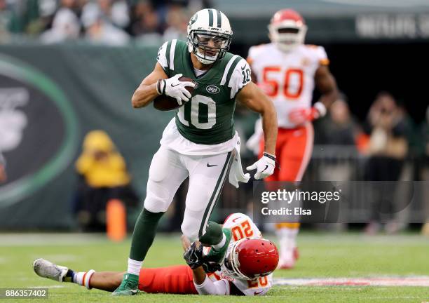 Jermaine Kearse of the New York Jets carries the ball as Steven Nelson of the Kansas City Chiefs defends on December 03, 2017 at MetLife Stadium in...