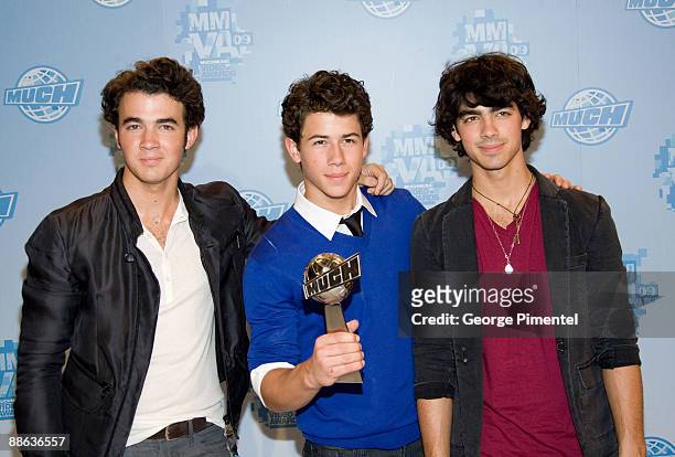 Kevin Jonas, Nick Jonas and Joe Jonas of the Jonas Brothers attend the press room at the 20th Annual MuchMusic Video Awards at the MuchMusic HQ on...