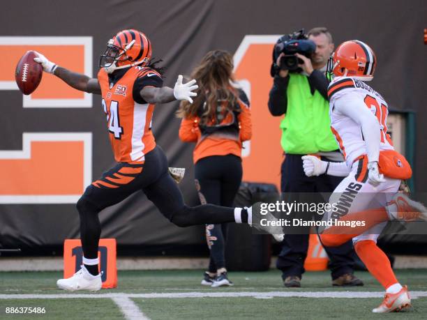 Cornerback Adam Jones of the Cincinnati Bengals celebrates as he returns a punt for a touchdown in the second quarter of a game on November 26, 2017...