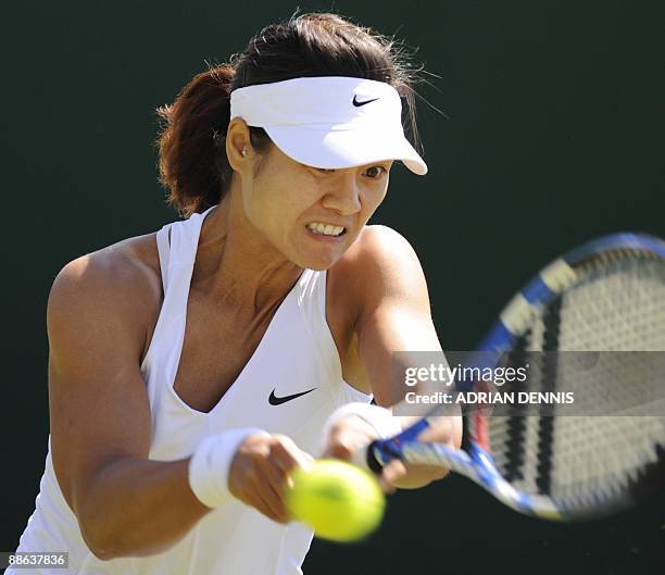 China's Na Li returns a ball to Kazhakstan's Galina Voskoboeva during their first round match of the 2009 Wimbledon tennis championships at the All...