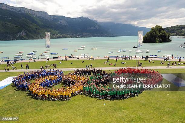 Almost 1000 French children form the five olympic rings, on June 23, 2009 in Annecy, French Alps, during the launch of the city's candidacy for the...