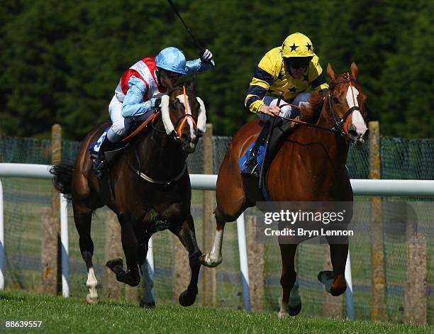 George Baker riding Caribbean Coral on their way to winning the On Your Mark's Lane during the handicap at Brighton Racecourse on June 23, 2009 in...