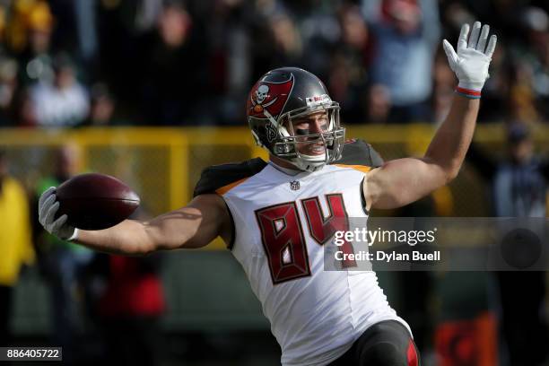 Cameron Brate of the Tampa Bay Buccaneers reacts after scoring a touchdown in the first quarter against the Green Bay Packers at Lambeau Field on...