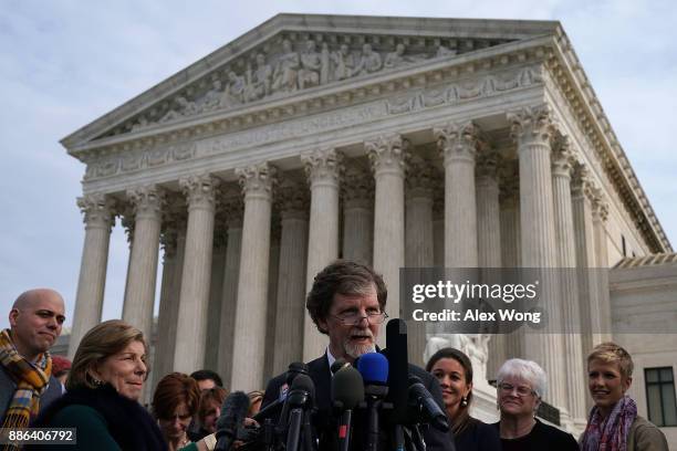 Cake artist Jack Phillips speaks to members of the media in front of the U.S. Supreme Court as floral artist Barronelle Stutzman looks on December 5,...