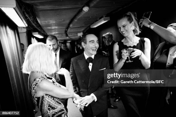 Donatella Versace, John Galliano and Eva Herzigova are seen backstage during The Fashion Awards 2017 in partnership with Swarovski at Royal Albert...