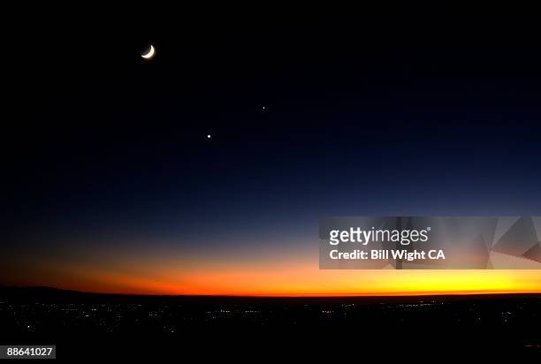 sunset and crescent moon with planets - jupiter planet stock pictures, royalty-free photos & images