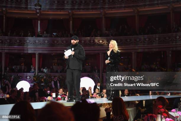 Michael Halpern , winner of the British Emerging Talent Womenswear award, and Pamela Anderson on stage during The Fashion Awards 2017 in partnership...