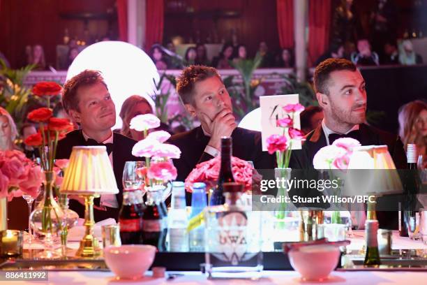 Guest, Christopher Bailey MBE and Sam Smith during The Fashion Awards 2017 in partnership with Swarovski at Royal Albert Hall on December 4, 2017 in...