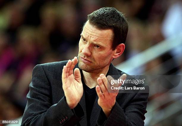 Coach Michael Koch of Bonn applauds during the BBL Play-Offs fourth final match between Telemom Baskets Bonn and EWE Baskets at the Telekom Dome on...