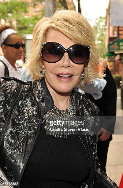 Joan Rivers visits the God's Love We Deliver facilities to donate her Celebrity Apprentice winnings on June 23, 2009 in New York City.