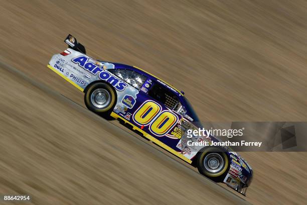 David Reutimann, driver of the Aaron's Dream Machine Toyota, drives during practice for the NASCAR Sprint Cup Series Toyota/Save Mart 350 at the...