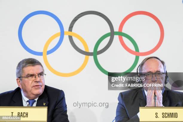 International Olympic Committee President Thomas Bach and Chairman of IOC Inquiry Commission into alleged Russian doping at Sochi 2014 Swiss Samuel...