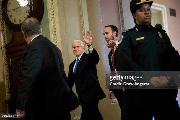 Vice President Mike Pence waves as he leave a meeting with Senate Republicans on Capitol Hill, December 5, 2017 in Washington, DC. After the Senate...