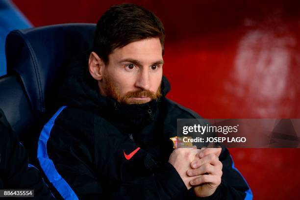 Barcelona's Argentinian forward Lionel Messi sits on the bench during the UEFA Champions League football match FC Barcelona vs Sporting CP at the...