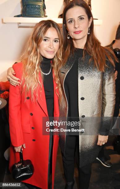 Miroslava Duma and Livia Firth attend the opening of the BOTTLETOP flagship store on Regent Street on December 5, 2017 in London, England.