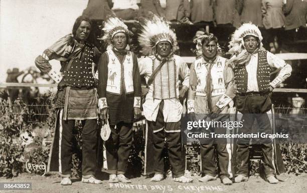 Postcard depicts four unidentified Native Americans s they pose at Frontier Days, Cheyenne, Wyoming, early 1900s.