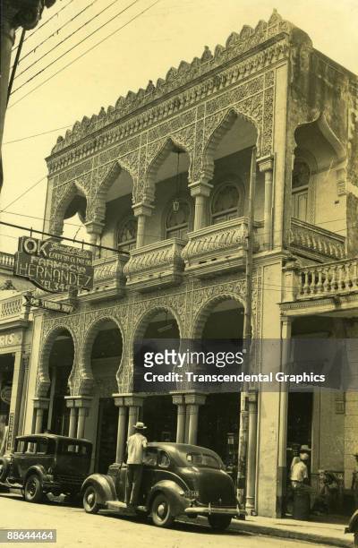 Exterior view of the OK Farmacia, Ciego de Avila, Cuba, 1930s. The facade exhibits many features of Moorish Revival architecture.